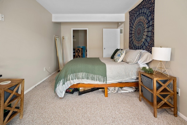 carpeted bedroom featuring baseboards