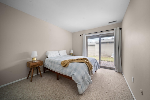 carpeted bedroom featuring access to exterior, visible vents, and baseboards