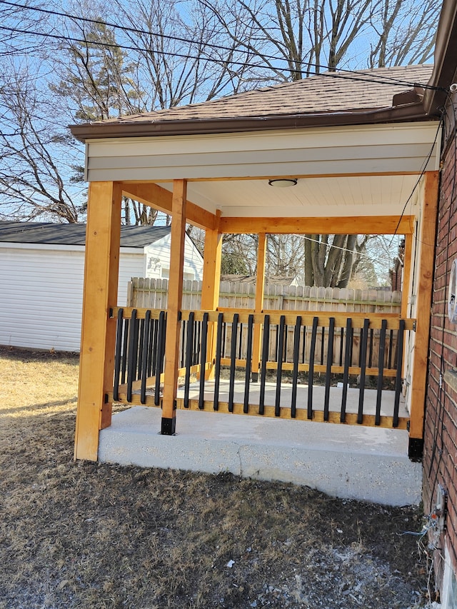 wooden terrace featuring fence