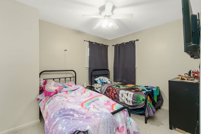 bedroom with carpet, baseboards, and ceiling fan
