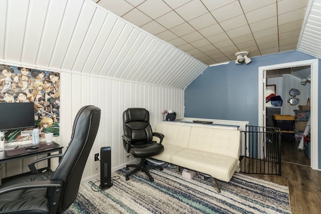 office featuring vaulted ceiling, wood finished floors, and baseboards