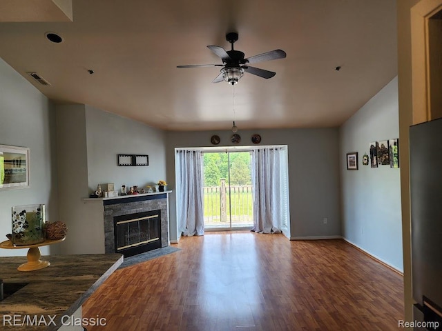 37512 Jefferson Ave Unit # 301, Harrison Township, MI 48045 - living area with wood finished floors, vaulted ceiling, ceiling fan, and a tiled fireplace