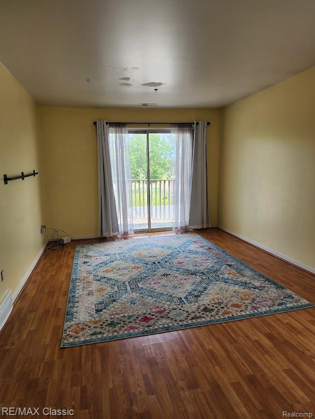 37512 Jefferson Ave Unit # 301, Harrison Township, MI 48045 - spare room featuring wood finished floors and baseboards