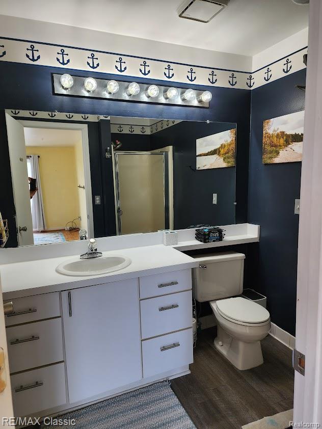 37512 Jefferson Ave Unit # 301, Harrison Township, MI 48045 - bathroom with vanity, toilet, and wood finished floors