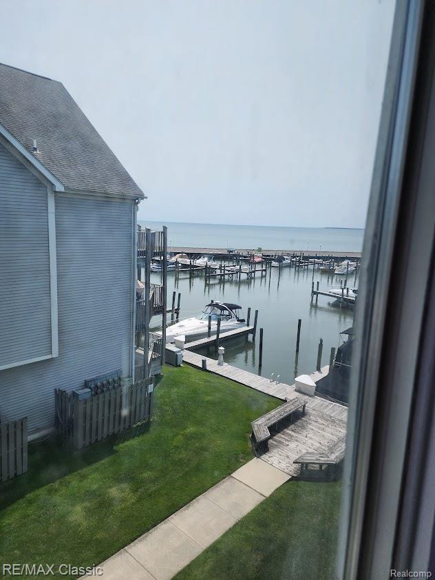 37512 Jefferson Ave Unit # 301, Harrison Township, MI 48045 - dock area featuring a water view and a lawn
