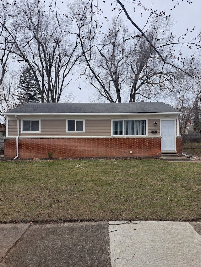 single story home with brick siding, a front lawn, and entry steps