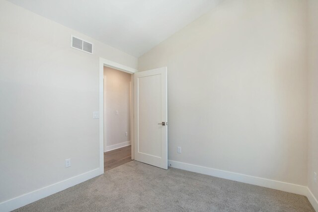 631 Fairview Ave NE Unit 3, Grand Rapids, MI 49503 - spare room with visible vents, light colored carpet, and baseboards