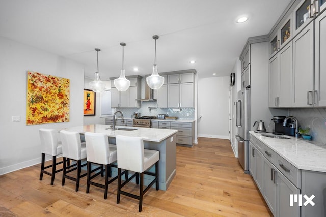 631 Fairview Ave NE Unit 3, Grand Rapids, MI 49503 - kitchen with a sink, stainless steel appliances, light wood-style floors, and gray cabinets