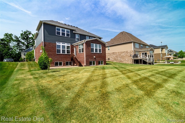 2959 Montgomery Cir, Walled Lake, MI 48390 - back of house with brick siding, stairs, and a yard
