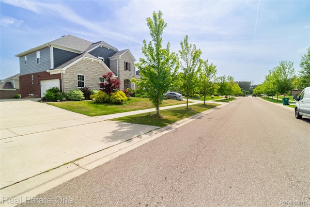 2959 Montgomery Cir, Walled Lake, MI 48390 - view of asphalt road featuring sidewalks and curbs