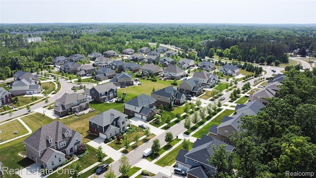 2959 Montgomery Cir, Walled Lake, MI 48390 - aerial view of residential area featuring a heavily wooded area