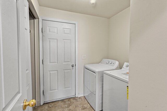 2105 Arcadia Dr, Canton, MI 48188 - laundry room with separate washer and dryer and light stone finish flooring