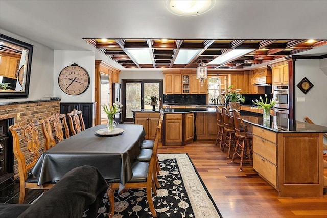 1270 John R Rd, Rochester Hills, MI 48307 - dining area featuring beam ceiling, wood finished floors, and coffered ceiling