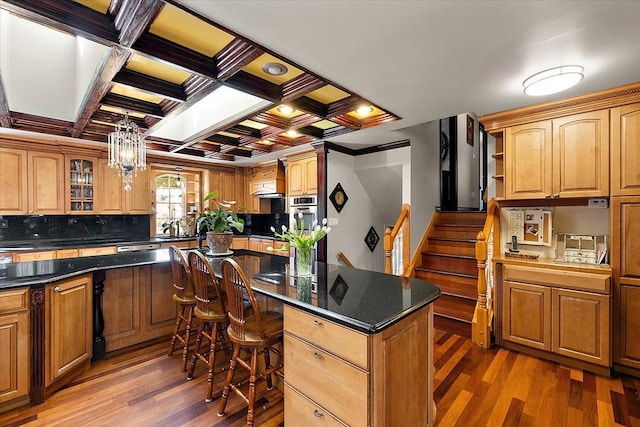 1270 John R Rd, Rochester Hills, MI 48307 - kitchen with coffered ceiling, open shelves, light wood-style floors, a kitchen bar, and a notable chandelier