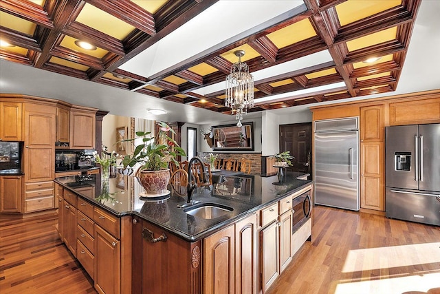 1270 John R Rd, Rochester Hills, MI 48307 - kitchen featuring wood finished floors, a spacious island, a sink, built in appliances, and tasteful backsplash