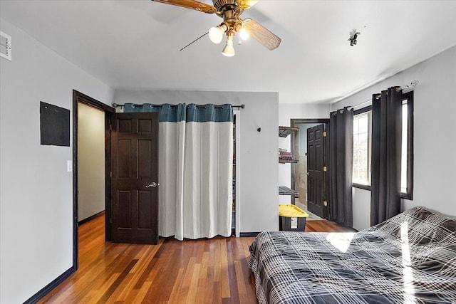 1270 John R Rd, Rochester Hills, MI 48307 - bedroom featuring baseboards, ceiling fan, and wood finished floors