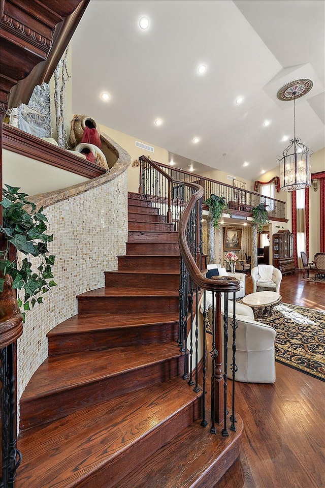 1270 John R Rd, Rochester Hills, MI 48307 - staircase with visible vents, wood finished floors, recessed lighting, an inviting chandelier, and lofted ceiling
