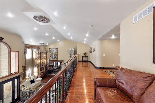 1270 John R Rd, Rochester Hills, MI 48307 - hall with visible vents, vaulted ceiling, recessed lighting, an inviting chandelier, and wood finished floors