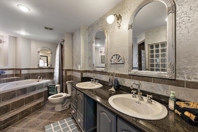 1270 John R Rd, Rochester Hills, MI 48307 - full bath featuring tile patterned floors, visible vents, tiled bath, and a sink