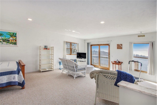 carpeted bedroom with access to exterior, baseboards, and recessed lighting