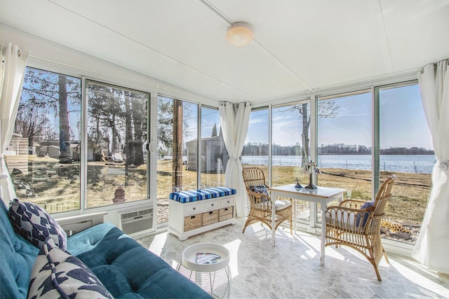 sunroom / solarium with a water view and vaulted ceiling