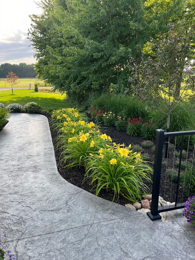 surrounding community with fence and a lawn