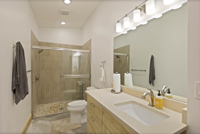 5595 Riverview Dr, Bridgeport, MI 48722 - bathroom featuring vanity, toilet, and a stall shower