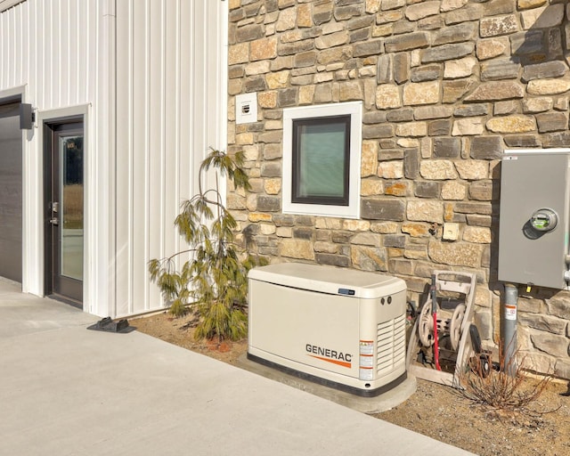 5595 Riverview Dr, Bridgeport, MI 48722 - exterior view of a power unit, stone siding, and board and batten siding