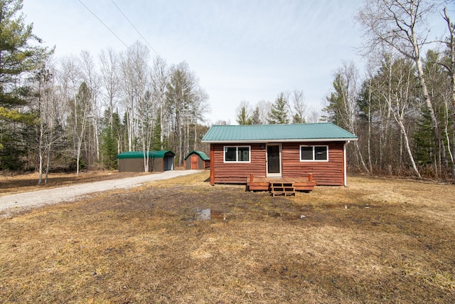 2340 Ryno Rd, Luzerne, MI 48636 - back of house with metal roof