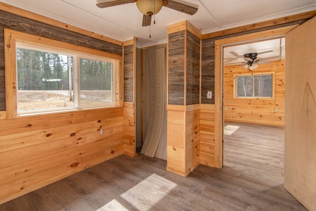 2340 Ryno Rd, Luzerne, MI 48636 - empty room featuring wooden walls, wood finished floors, and ceiling fan