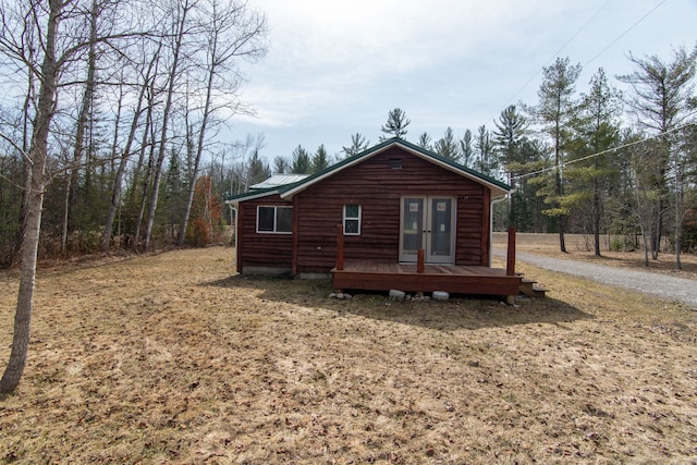 2340 Ryno Rd, Luzerne, MI 48636 - back of property featuring french doors, driveway, and metal roof