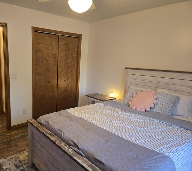 6560 Blue Lake Rd, Twin Lake, MI 49457 - bedroom featuring wood finished floors, a closet, baseboards, and ceiling fan