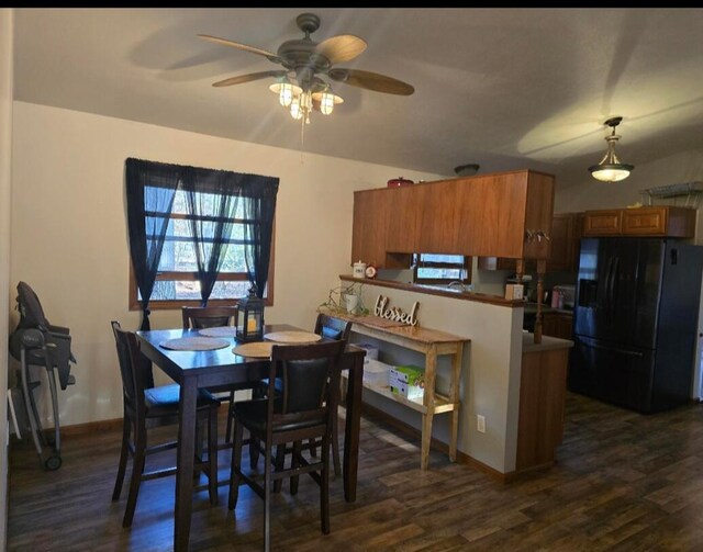 6560 Blue Lake Rd, Twin Lake, MI 49457 - dining space featuring ceiling fan, dark wood-type flooring, and baseboards