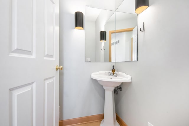 19148 Maiden Ln, Spring Lake, MI 49456 - bathroom featuring baseboards