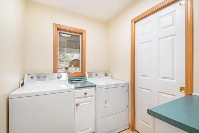 19148 Maiden Ln, Spring Lake, MI 49456 - washroom featuring washer and dryer and cabinet space
