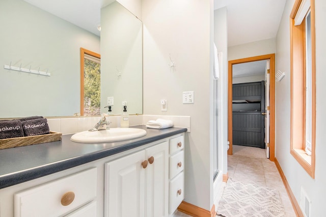 19148 Maiden Ln, Spring Lake, MI 49456 - bathroom with vanity, tile patterned flooring, and a shower with door