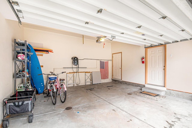 19148 Maiden Ln, Spring Lake, MI 49456 - garage featuring a garage door opener