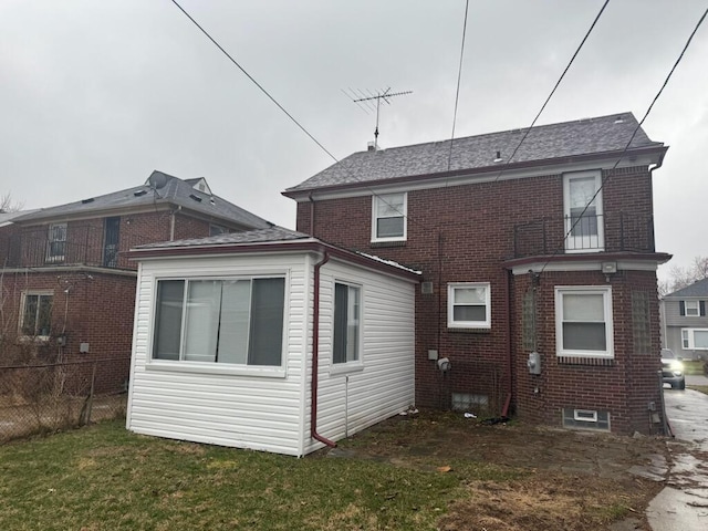 18308 Littlefield St, Detroit, MI 48235 - back of property featuring a yard, fence, brick siding, and roof with shingles