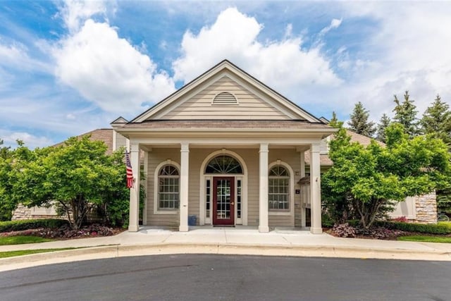 doorway to property featuring covered porch