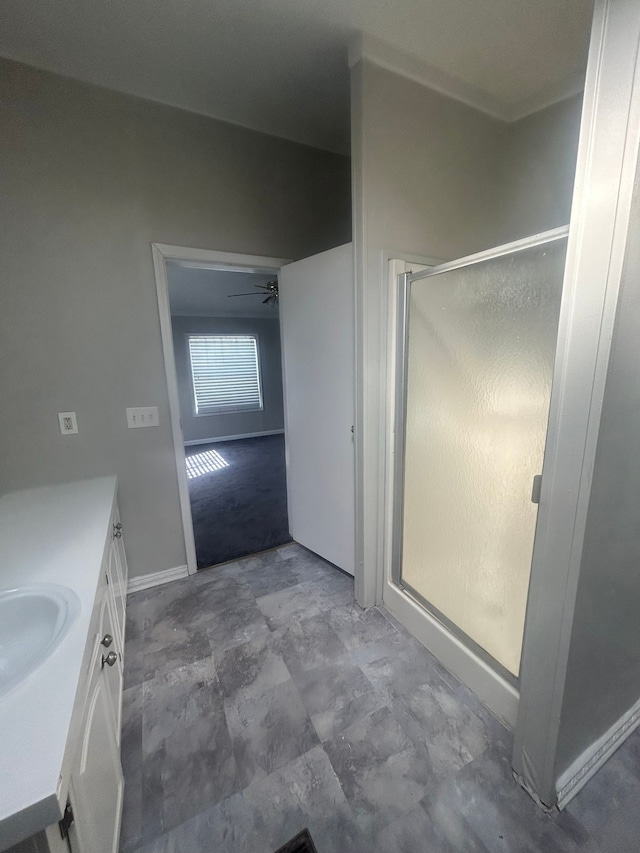 bathroom featuring vanity and a shower stall