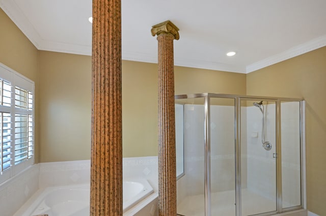 full bath with decorative columns, a stall shower, a garden tub, and crown molding