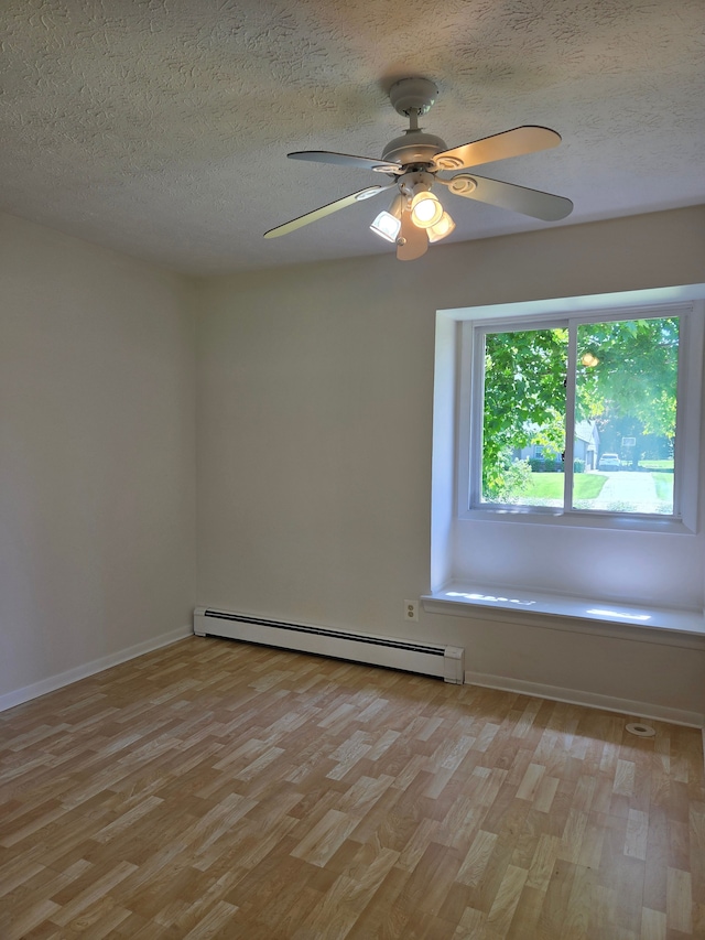 3380 Watersedge Dr, Brighton, MI 48114 - empty room featuring light wood-type flooring, a baseboard radiator, a textured ceiling, a ceiling fan, and baseboards