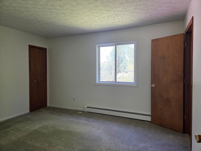 3380 Watersedge Dr, Brighton, MI 48114 - unfurnished bedroom with a baseboard heating unit, carpet, a textured ceiling, baseboards, and a closet
