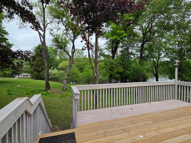3380 Watersedge Dr, Brighton, MI 48114 - deck featuring a lawn and view of scattered trees