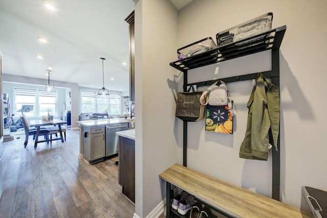 mudroom featuring recessed lighting, wood finished floors, and baseboards