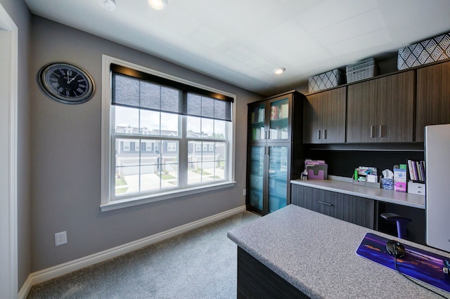 carpeted office featuring baseboards, recessed lighting, and built in study area