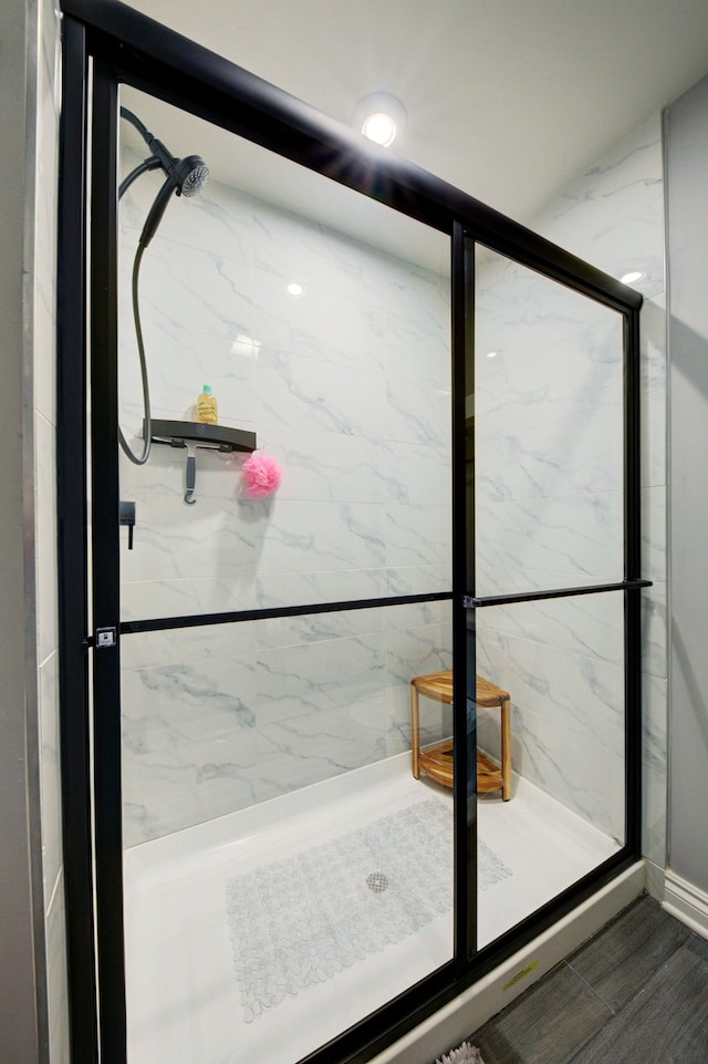 full bath with recessed lighting and a marble finish shower