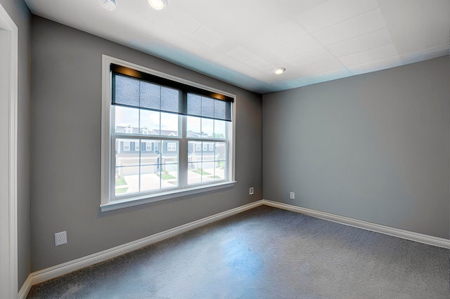 empty room with recessed lighting, carpet flooring, and baseboards