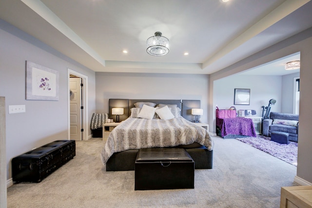 bedroom featuring baseboards, recessed lighting, a raised ceiling, and carpet