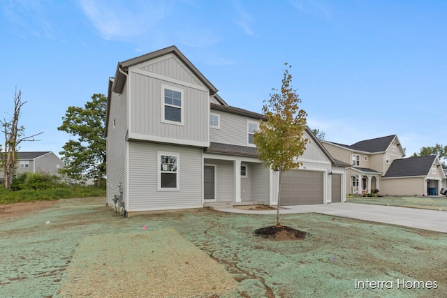 343 Seneca Ridge Dr Unit 40, Middleville, MI 49333 - view of front of house with board and batten siding, driveway, and an attached garage